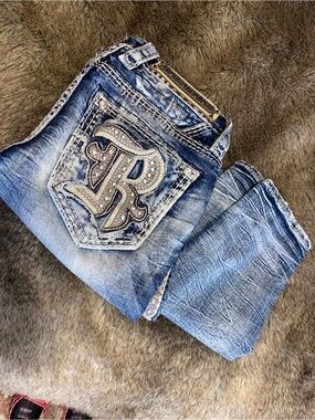 Rock Revival Women’s Light Blue Slim Straight Jeans with Rhinestone Pocket